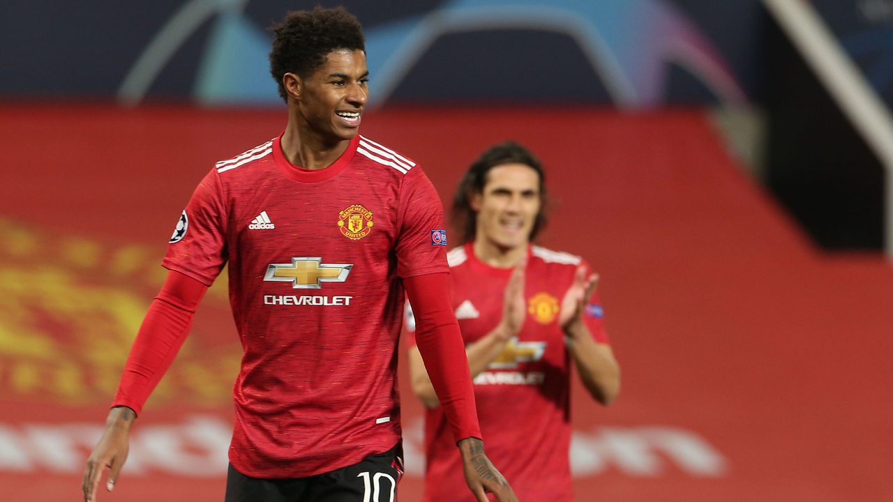 MANCHESTER, ENGLAND - OCTOBER 28: Marcus Rashford of Manchester United celebrates scoring their fifth goal during the UEFA Champions League Group H stage match between Manchester United and RB Leipzig at Old Trafford on October 28, 2020 in Manchester, England. Sporting stadiums around the UK remain under strict restrictions due to the Coronavirus Pandemic as Government social distancing laws prohibit fans inside venues resulting in games being played behind closed doors.