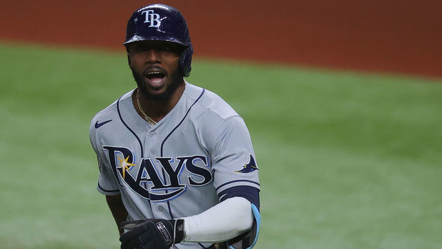 ARLINGTON, TEXAS - OCTOBER 27: Randy Arozarena #56 of the Tampa Bay Rays celebrates after hitting a solo home run against the Los Angeles Dodgers during the first inning in Game Six of the 2020 MLB World Series at Globe Life Field on October 27, 2020 in Arlington, Texas.