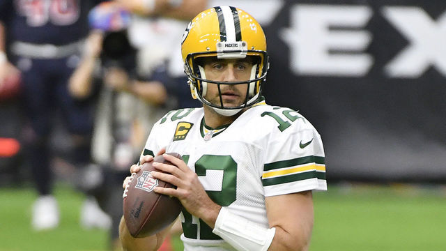 HOUSTON, TEXAS - OCTOBER 25: Aaron Rodgers #12 of the Green Bay Packers looks to pass against the Houston Texans during the first quarter at NRG Stadium on October 25, 2020 in Houston, Texas.