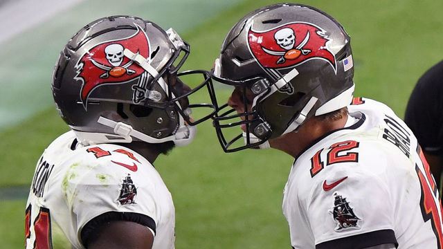 LAS VEGAS, NEVADA - OCTOBER 25: Wide receiver Chris Godwin #14 and quarterback Tom Brady #12 of the Tampa Bay Buccaneers celebrate after they connected on a 4-yard touchdown pass against the Las Vegas Raiders during the second half of their game at Allegiant Stadium on October 25, 2020 in Las Vegas, Nevada. The Buccaneers defeated the Raiders 45-20.
