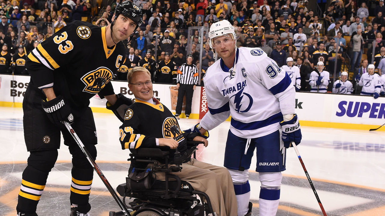 BOSTON, MA - OCTOBER 12 : Travis Roy drops the puck at center ice before the game with Zdeno Chara #33 of the Boston Bruins and Steven Stamkos #91 the Tampa Bay Lightning at the TD Garden on October 12, 2015 in Boston, Massachusetts.