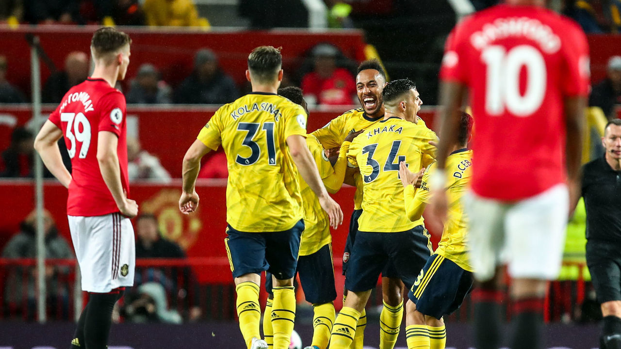 MANCHESTER, ENGLAND - SEPTEMBER 30: Pierre-Emerick Aubameyang of Arsenal celebrates after scoring a goal to make it 1-1 during the Premier League match between Manchester United and Arsenal FC at Old Trafford on September 30, 2019 in Manchester, United Kingdom.