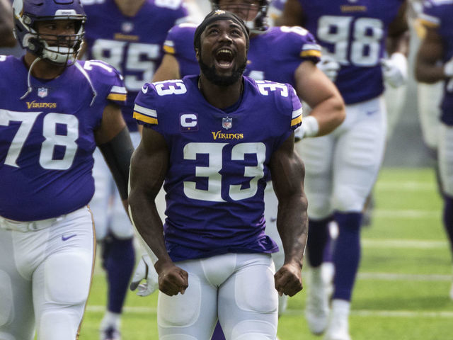 MINNEAPOLIS, MN - SEPTEMBER 27: Dalvin Cook #33 of the Minnesota Vikings and his teammates take the field before the game against the Tennessee Titans at U.S. Bank Stadium on September 27, 2020 in Minneapolis, Minnesota.