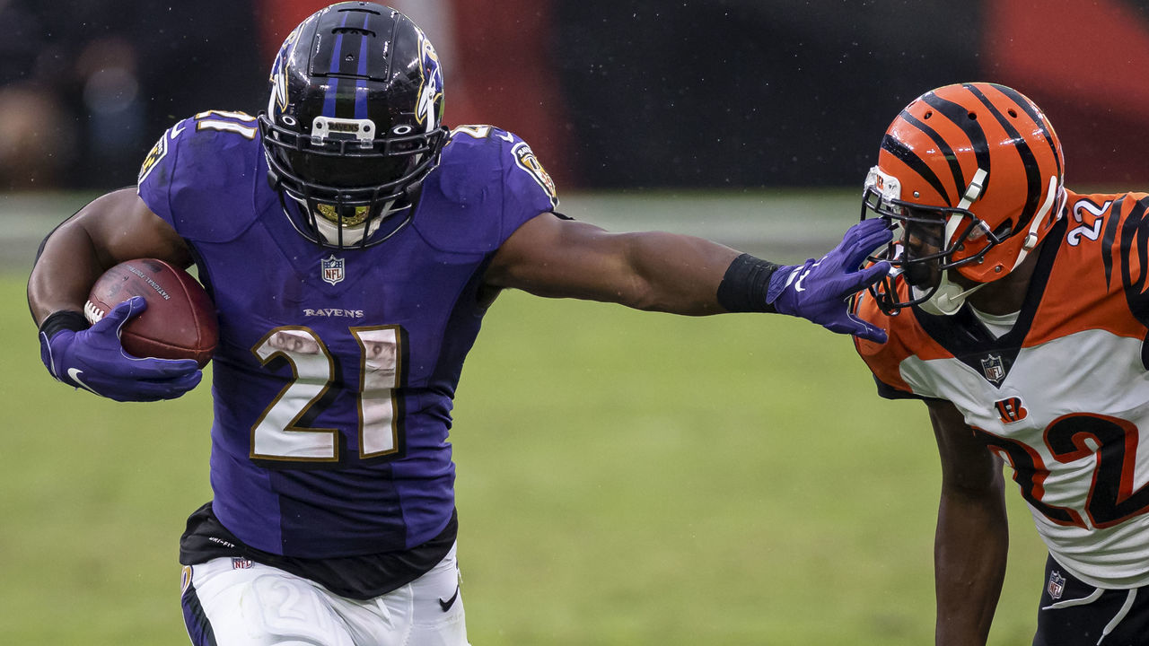 BALTIMORE, MD - OCTOBER 11: Mark Ingram #21 of the Baltimore Ravens stiff-arms William Jackson #22 of the Cincinnati Bengals during the second half at M&T Bank Stadium on October 11, 2020 in Baltimore, Maryland.