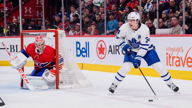 MONTREAL, QC - FEBRUARY 08: Auston Matthews (34) of the Toronto Maple Leafs skates the puck around the net of Carey Price (31) of the Montreal Canadiens during the second period of the NHL game between the Toronto Maple Leafs and the Montreal Canadiens on February 8, 2020, at the Bell Centre in Montreal, QC
