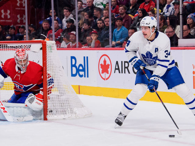 MONTREAL, QC - FEBRUARY 08: Auston Matthews (34) of the Toronto Maple Leafs skates the puck around the net of Carey Price (31) of the Montreal Canadiens during the second period of the NHL game between the Toronto Maple Leafs and the Montreal Canadiens on February 8, 2020, at the Bell Centre in Montreal, QC