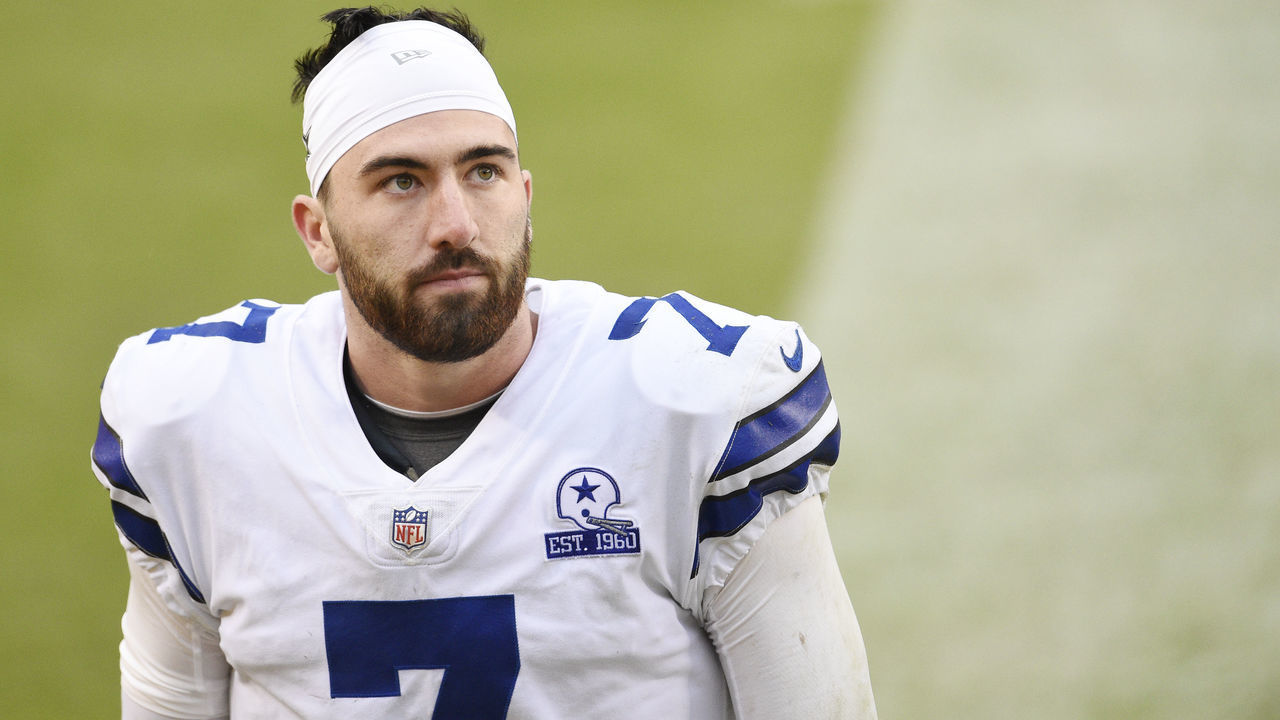 LANDOVER, MARYLAND - OCTOBER 25: Quarterback Ben DiNucci #7 of the Dallas Cowboys walks off the field after their 25-3 loss against the Washington Football Team at FedExField on October 25, 2020 in Landover, Maryland.