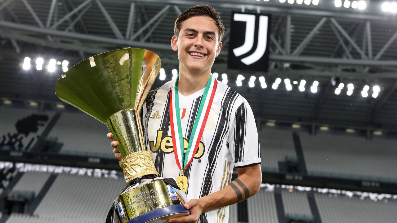 TURIN, ITALY - AUGUST 01: Paulo Dybala of Juventus celebrates with the scudetto following the Serie A match between Juventus and AS Roma at on August 01, 2020 in Turin, Italy.