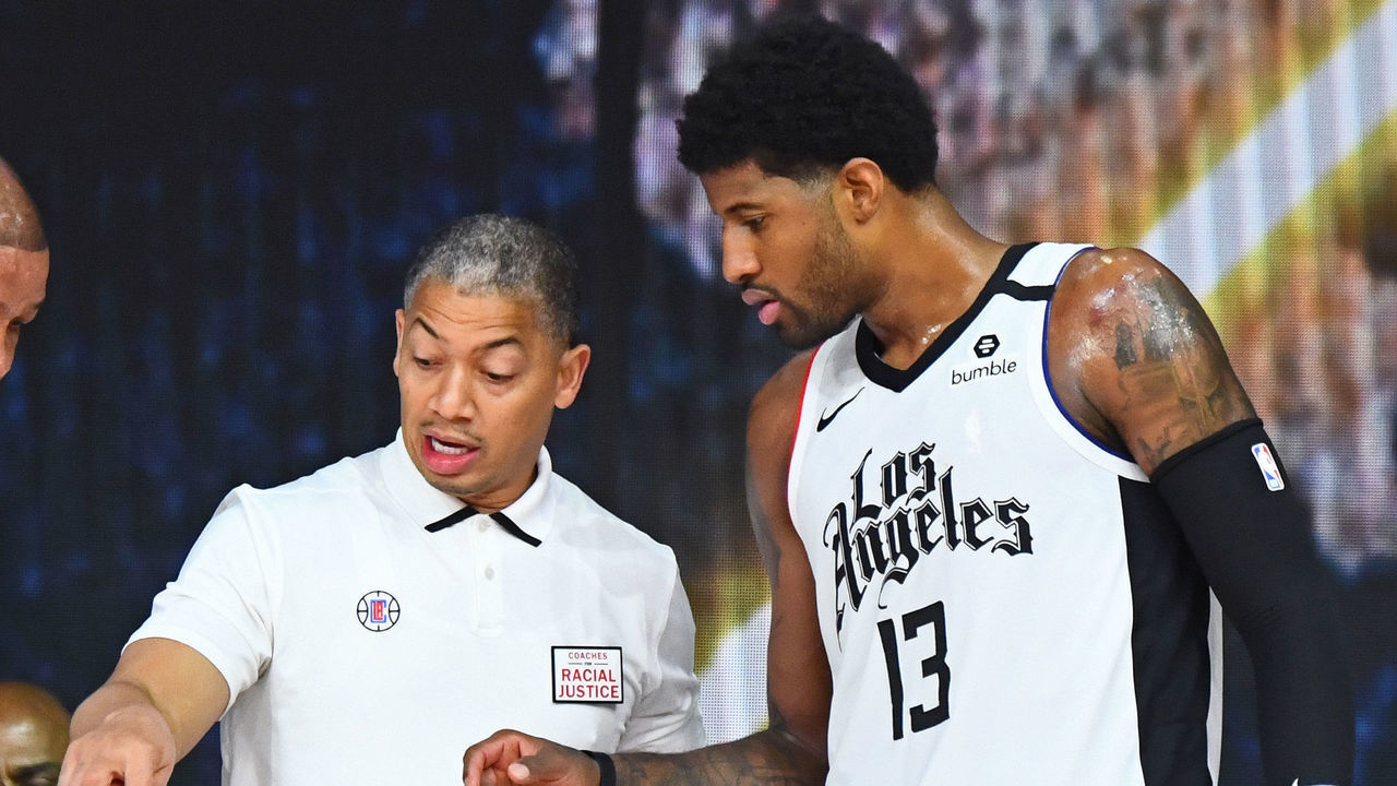 ORLANDO, FL - SEPTEMBER 7: Doc Rivers of the LA Clippers Tyronn Lue of the LA Clippers and Paul George #13 of the LA Clippers talk during the game against the Denver Nuggets during Round Two, Game Three of the Western Conference Semifinals on September 7, 2020 at the AdventHealth Arena at ESPN Wide World Of Sports Complex in Orlando, Florida. NOTE TO USER: User expressly acknowledges and agrees that, by downloading and/or using this Photograph, user is consenting to the terms and conditions of the Getty Images License Agreement. Mandatory Copyright Notice: Copyright 2020 NBAE