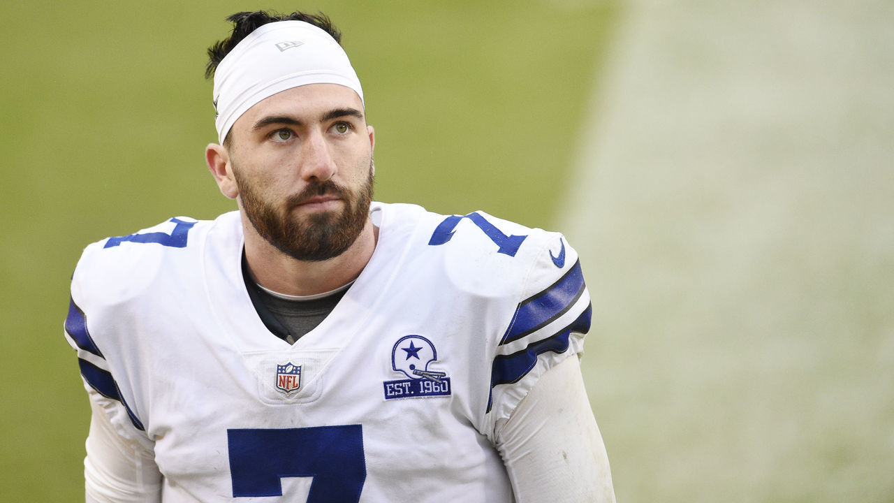 LANDOVER, MARYLAND - OCTOBER 25: Quarterback Ben DiNucci #7 of the Dallas Cowboys walks off the field after their 25-3 loss against the Washington Football Team at FedExField on October 25, 2020 in Landover, Maryland.