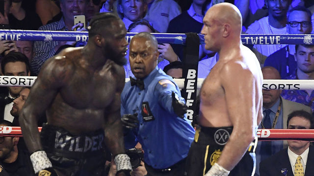 LAS VEGAS, NV - FEBRUARY 22: (in black//yellow trunks) Tyson Fury goes 7 rounds with Deontay Wilder at the MGM Grand Hotel February 22, 2020 in Las Vegas, Nevada. Tyson Fury took the win by TKO in the 7th round as the towel was thrown in by the Wilder team for the world heavyweight championship in Las Vegas, Nevada.