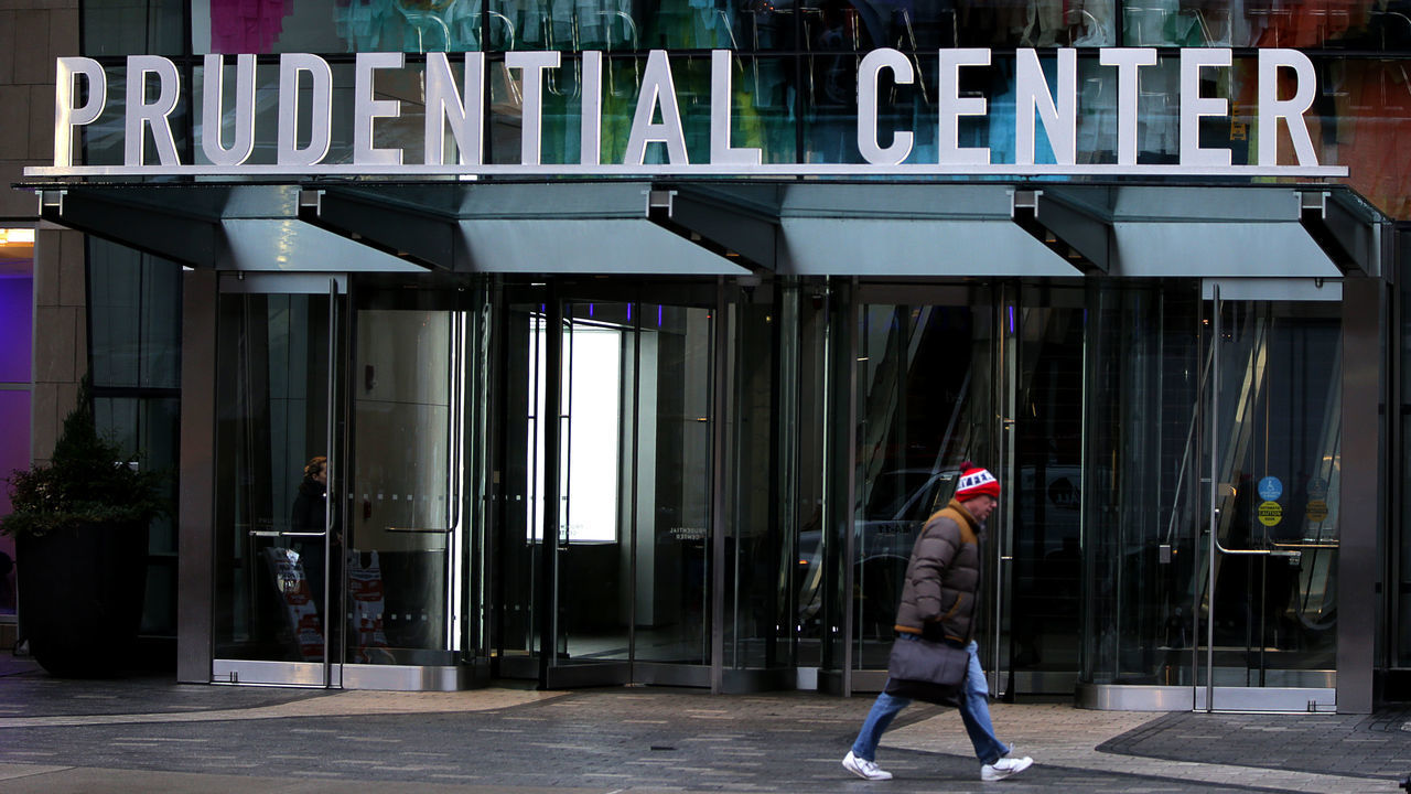 BOSTON, MA - MARCH 24: A lone pedestrian passes by a closed Prudential Center on March 24, 2020 in Boston as the COVID-19 pandemic continues. The city of Boston gets emptier and emptier every day during the COVID-19 epidemic. Charlie Baker ordered all nonessential workers to stay home to prevent the spread of the virus and issued a stay-at-home advisory.