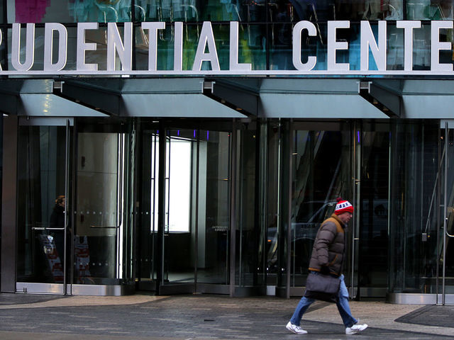 BOSTON, MA - MARCH 24: A lone pedestrian passes by a closed Prudential Center on March 24, 2020 in Boston as the COVID-19 pandemic continues. The city of Boston gets emptier and emptier every day during the COVID-19 epidemic. Charlie Baker ordered all nonessential workers to stay home to prevent the spread of the virus and issued a stay-at-home advisory.