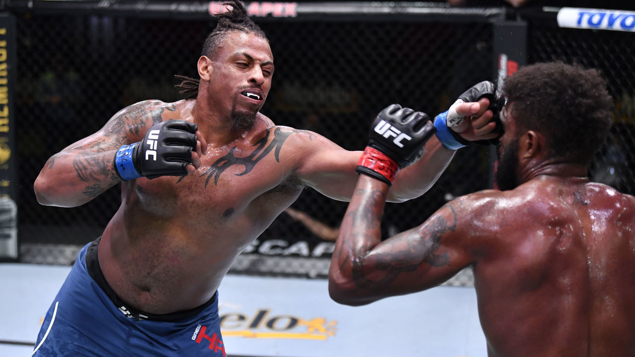 LAS VEGAS, NEVADA - OCTOBER 31: (L-R) Greg Hardy punches Maurice Greene in a heavyweight bout during the UFC Fight Night event at UFC APEX on October 31, 2020 in Las Vegas, Nevada.