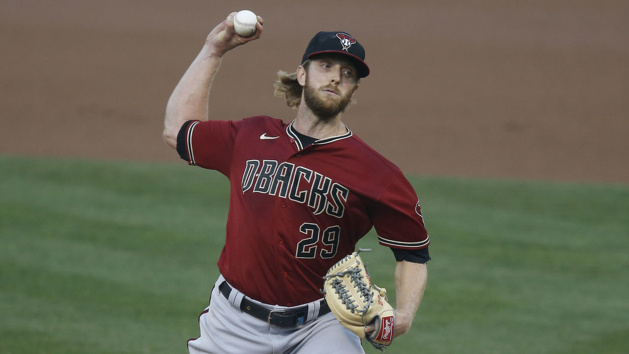OAKLAND, CALIFORNIA - AUGUST 19: Merrill Kelly #29 of the Arizona Diamondbacks pitches in the bottom of the first inning against the Oakland Athletics at Oakland-Alameda County Coliseum on August 19, 2020 in Oakland, California.
