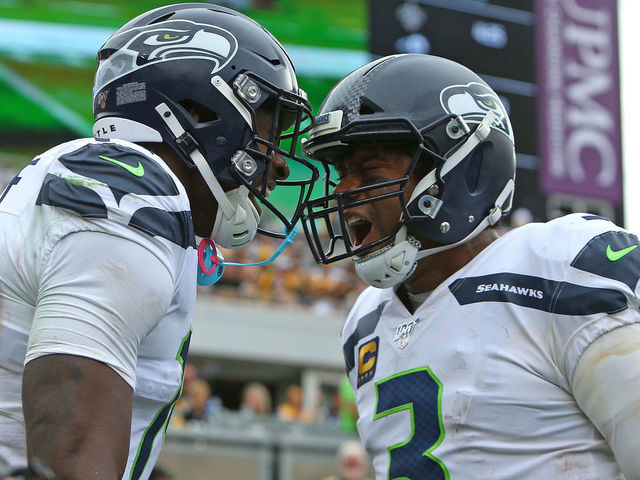 PITTSBURGH, PA - SEPTEMBER 15: D.K. Metcalf #14 of the Seattle Seahawks and Russell Wilson #3 of the Seattle Seahawks in action against the Pittsburgh Steelers on September 15, 2019 at Heinz Field in Pittsburgh, Pennsylvania.