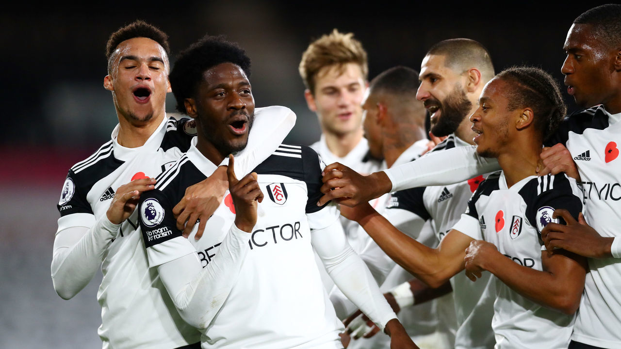 LONDON, ENGLAND - NOVEMBER 02: Ola Aina of Fulham celebrates with teammates after scoring his team's second goal during the Premier League match between Fulham and West Bromwich Albion at Craven Cottage on November 02, 2020 in London, England. Sporting stadiums around the UK remain under strict restrictions due to the Coronavirus Pandemic as Government social distancing laws prohibit fans inside venues resulting in games being played behind closed doors.
