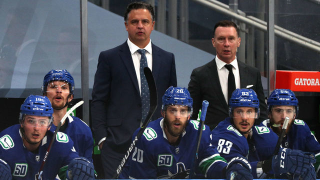 EDMONTON, ALBERTA - AUGUST 04: Head coach Travis Green and assistant coach Newell Brown of the Vancouver Canucks watch the play from the bench during the second period of Game Two of the Western Conference Qualification Round against the Minnesota Wild at Rogers Place on August 04, 2020 in Edmonton, Alberta.