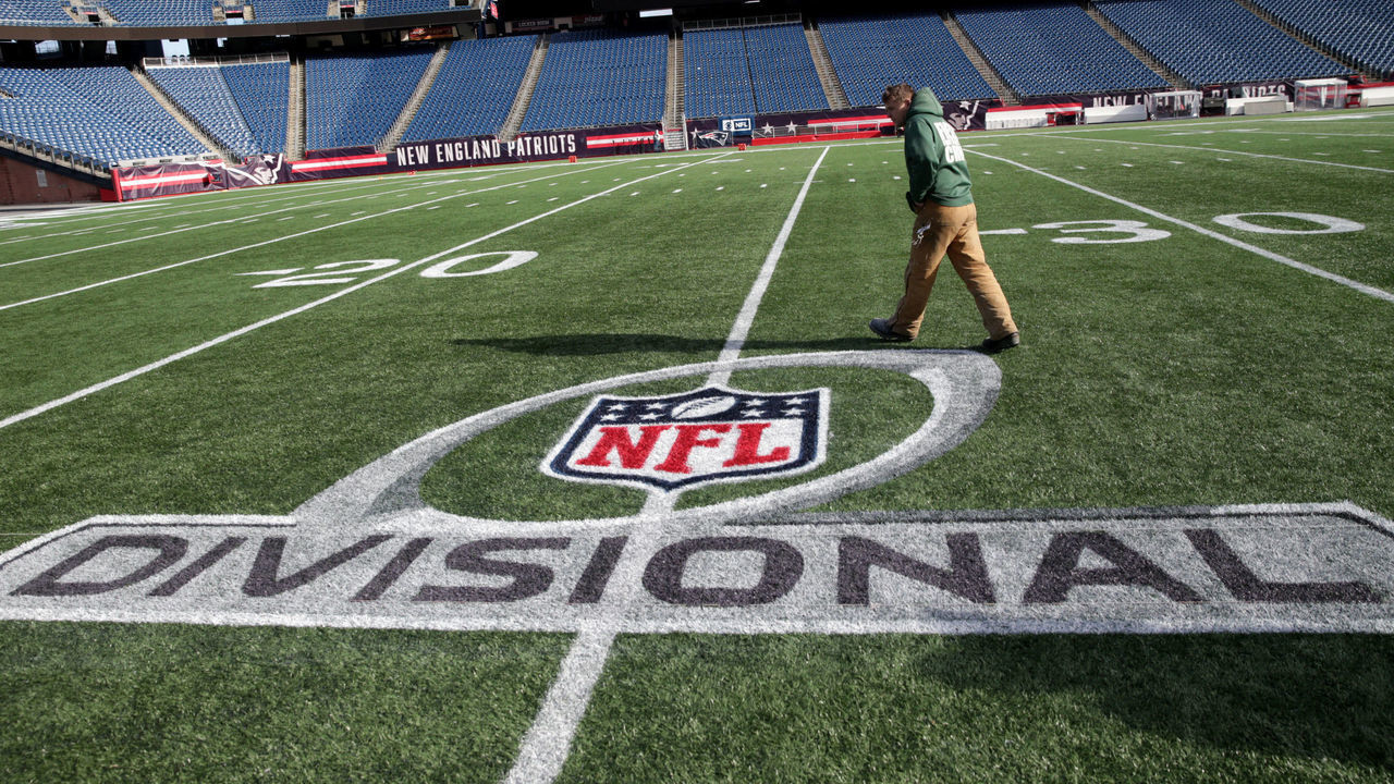 FOXBOROUGH, MA - JANUARY 9: Thomas Mistowski, foreman of the Gillette Stadium field crew, walks past the AFC Divisional Playoff round logo that his crew painted onto the field ahead of Sunday's game between the New England Patriots and the Los Angeles Chargers at Gillette Stadium in Foxborough, MA on Jan. 9, 2019.