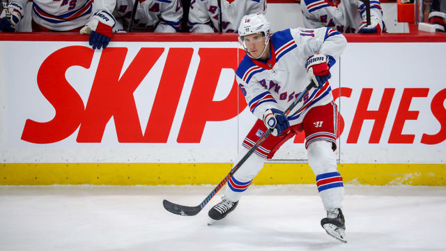 WINNIPEG, MB - FEBRUARY 11: Ryan Strome #16 of the New York Rangers passes the puck up the ice during first period action against the Winnipeg Jets at the Bell MTS Place on February 11, 2020 in Winnipeg, Manitoba, Canada. The Rangers defeated the Jets 4-1.