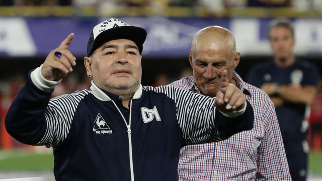 Argentine former football star Diego Maradona acknowledges spectators during an homage before the start of the Argentina First Division 2020 Superliga Tournament football match Boca Juniors vs Gimnasia La Plata, at La Bombonera stadium, in Buenos Aires, on March 7, 2020.