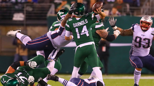 EAST RUTHERFORD, NJ - OCTOBER 21: New England Patriots defensive tackle Danny Shelton (71) pressures New York Jets quarterback Sam Darnold (14) and hits him in the head during the second quarter of the National Football League game between the New York Jets and the New England Patriots on October 21, 2019 at MetLife Stadium in East Rutherford, NJ