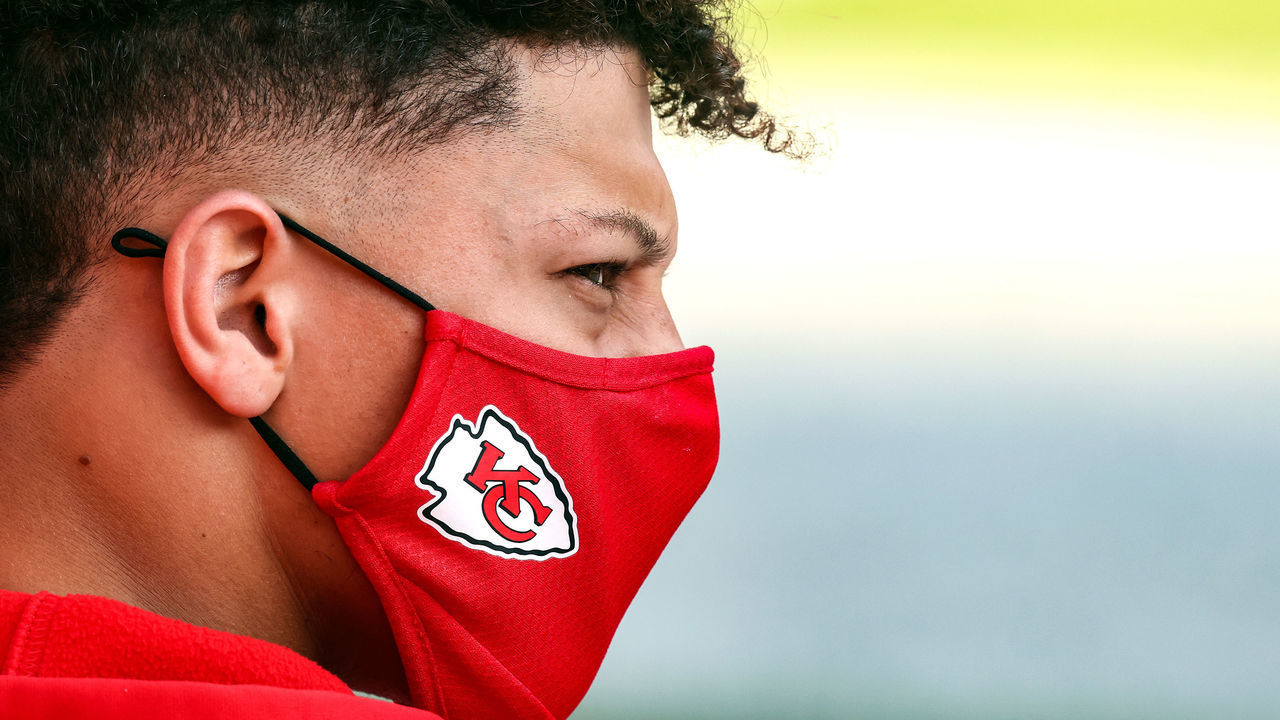 KANSAS CITY, MISSOURI - OCTOBER 11: Patrick Mahomes #15 of the Kansas City Chiefs looks on with his mask prior to the game against the Las Vegas Raiders at Arrowhead Stadium on October 11, 2020 in Kansas City, Missouri.