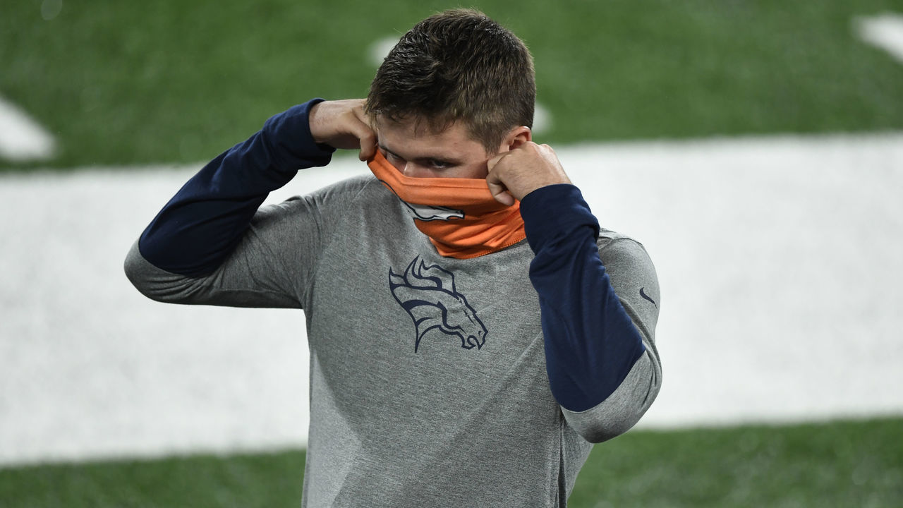 RUTHERFORD, NJ - OCTOBER 01: Denver Broncos quarterback Drew Lock (3) secures his mask on the bench during the game against the New York Jets at MetLife Stadium October 01, 2020. "n"n