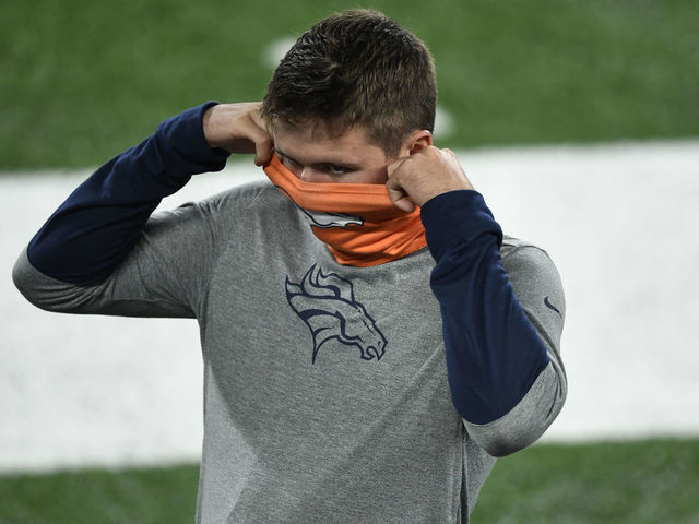 RUTHERFORD, NJ - OCTOBER 01: Denver Broncos quarterback Drew Lock (3) secures his mask on the bench during the game against the New York Jets at MetLife Stadium October 01, 2020. "n"n