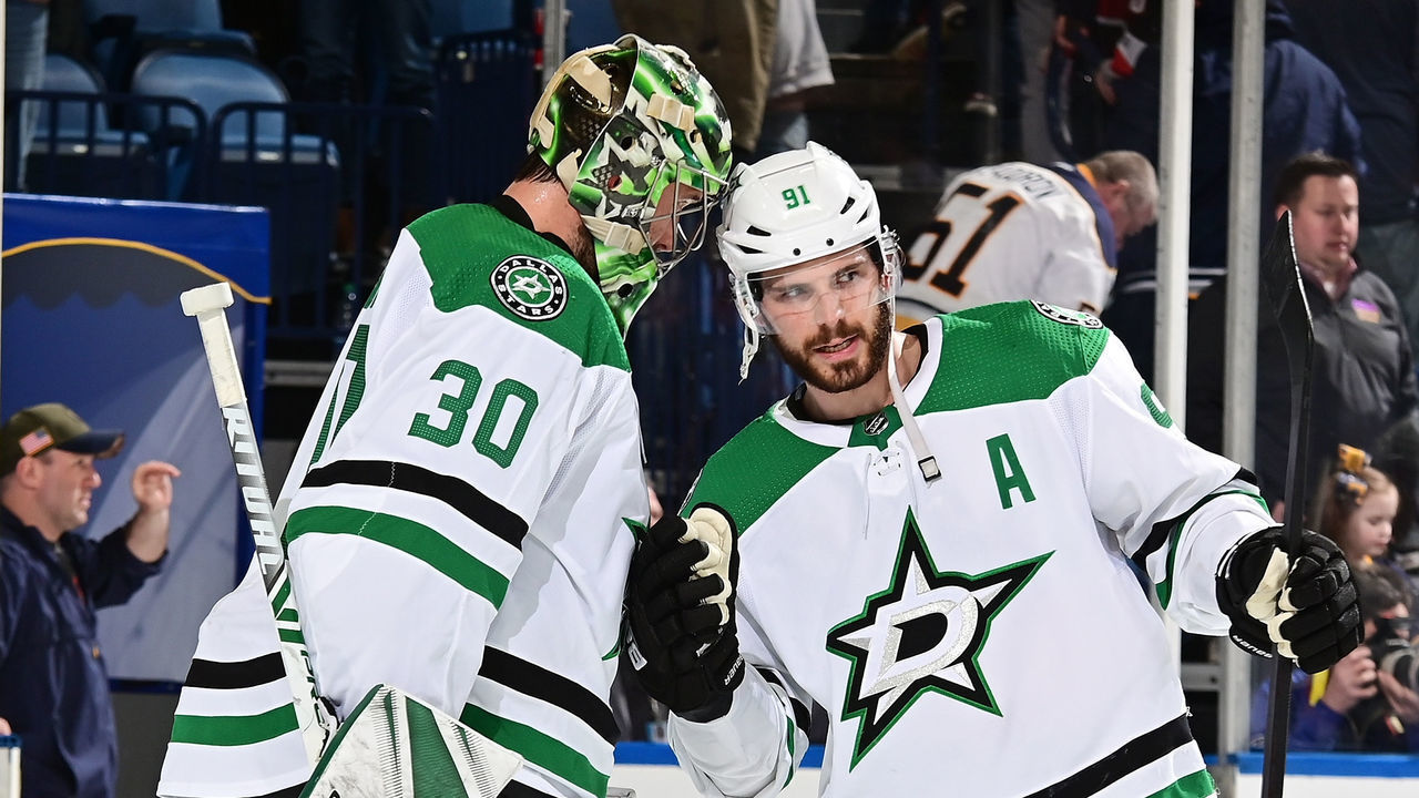 BUFFALO, NY - MARCH 12: Ben Bishop #30 of the Dallas Stars celebrates a shutout victory over the Buffalo Sabres with Tyler Seguin #91 following an NHL game on March 12, 2019 at KeyBank Center in Buffalo, New York. Dallas won, 2-0.