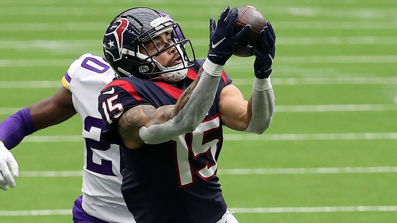 HOUSTON, TEXAS - OCTOBER 04: Will Fuller #15 of the Houston Texans makes a catch as Jeff Gladney #20 of the Minnesota Vikings defends during the third quarter at NRG Stadium on October 04, 2020 in Houston, Texas.