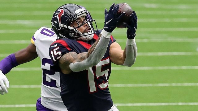 HOUSTON, TEXAS - OCTOBER 04: Will Fuller #15 of the Houston Texans makes a catch as Jeff Gladney #20 of the Minnesota Vikings defends during the third quarter at NRG Stadium on October 04, 2020 in Houston, Texas.
