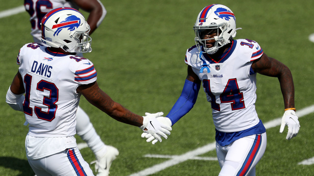 ORCHARD PARK, NEW YORK - SEPTEMBER 27: Gabriel Davis #13 of the Buffalo Bills slaps hands with teammate Stefon Diggs #14 after Diggs scored a touchdown during the first quarter against the Los Angeles Rams at Bills Stadium on September 27, 2020 in Orchard Park, New York.