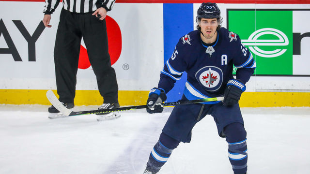 WINNIPEG, MB - FEBRUARY 8: Mark Scheifele #55 of the Winnipeg Jets keeps an eye on the play during first period action against the Ottawa Senators at the Bell MTS Place on February 8, 2020 in Winnipeg, Manitoba, Canada. The Jets defeated the Sens 5-2.