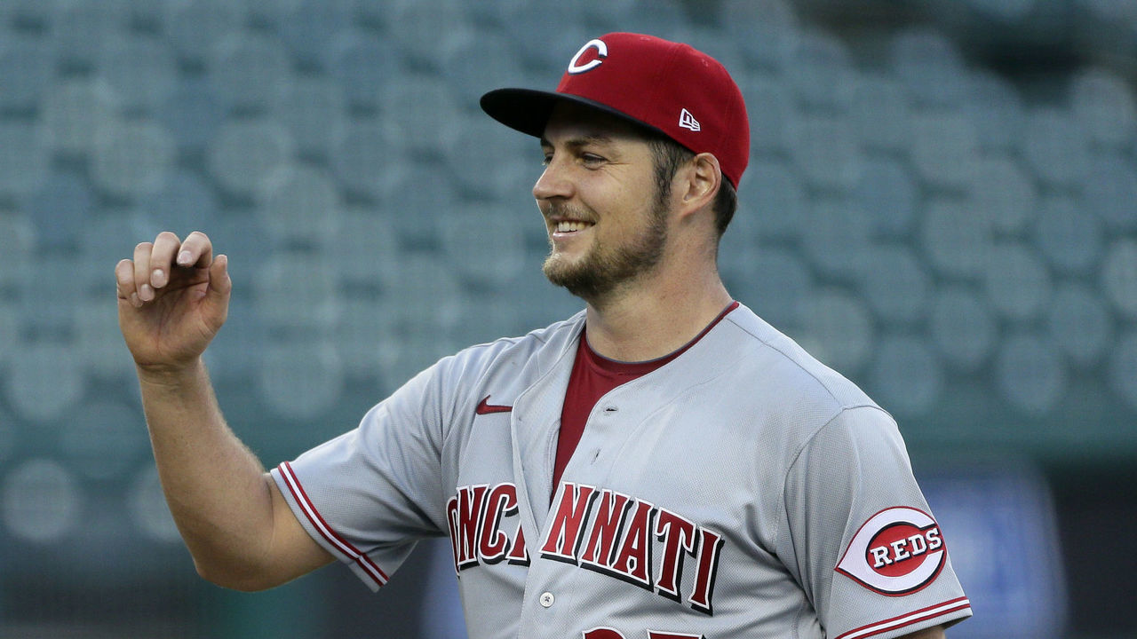 DETROIT, MI - AUGUST 2: Trevor Bauer #27 of the Cincinnati Reds smiles as he is greeted by Mike Moustakas #9 after a 4-0, even inning, complete game win over the Detroit Tigers in game two of a doubleheader at Comerica Park on August 2, 2020, in Detroit, Michigan.