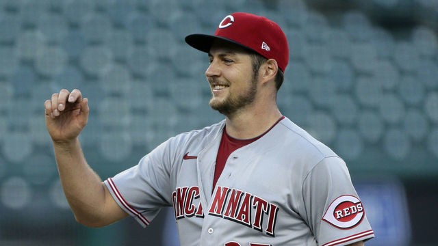 DETROIT, MI - AUGUST 2: Trevor Bauer #27 of the Cincinnati Reds smiles as he is greeted by Mike Moustakas #9 after a 4-0, even inning, complete game win over the Detroit Tigers in game two of a doubleheader at Comerica Park on August 2, 2020, in Detroit, Michigan.