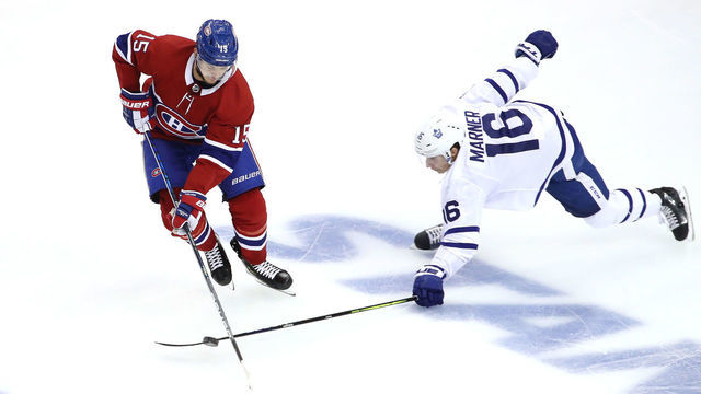 TORONTO, ONTARIO - JULY 28: Jesperi Kotkaniemi #15 of the Montreal Canadiens tries to keep the puck from Mitchell Marner #16 of the Toronto Maple Leafs in the third period during an exhibition game prior to the 2020 NHL Stanley Cup Playoffs at Scotiabank Arena on July 28, 2020 in Toronto, Ontario.