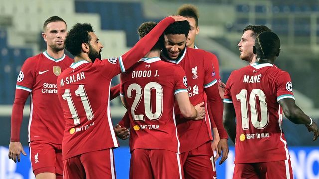 Liverpool's Portuguese striker Diogo Jota (C) is congratulated by Liverpool's Egyptian midfielder Mohamed Salah (L) after scoring a goal during the UEFA Champions league football match Atalanta Bergamo vs Liverpool, on November 3, 2020 at the Atalanta stadium in Bergamo.