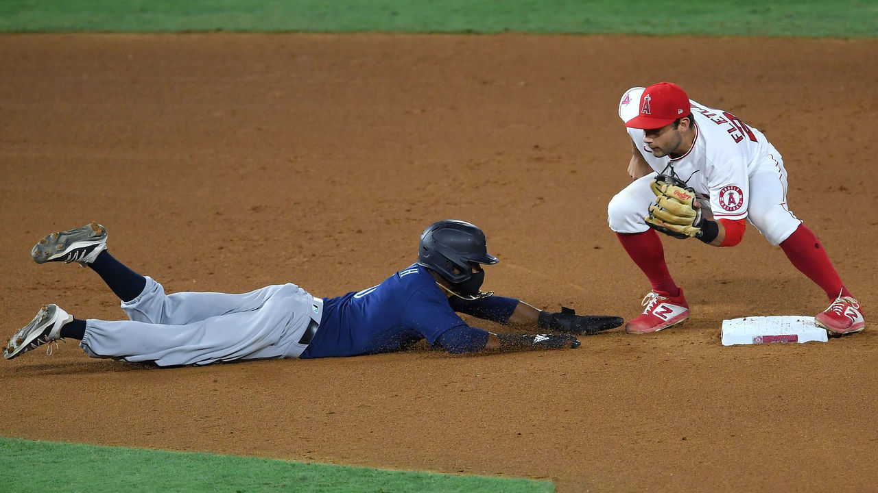 ANAHEIM, CA - JULY 30: David Fletcher #22 of the Los Angeles Angels makes the tag as Mallex Smith #0 of the Seattle Mariners is picked off at second on a throw by Felix Peña #64 of the Los Angeles Angels in the seventh inning of the game at Angel Stadium of Anaheim on July 30, 2020 in Anaheim, California.