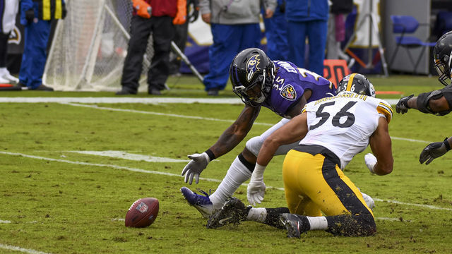 BALTIMORE, MD - NOVEMBER 01: Baltimore Ravens running back Gus Edwards (35) fumbles the ball during the Pittsburgh Steelers game versus the Baltimore Ravens on November 1, 2020 at M&T Bank Stadium in Baltimore, MD.