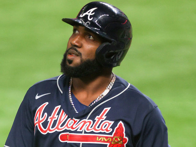 ARLINGTON, TEXAS - OCTOBER 18: Marcell Ozuna #20 of the Atlanta Braves flies out against the Los Angeles Dodgers during the third inning in Game Seven of the National League Championship Series at Globe Life Field on October 18, 2020 in Arlington, Texas.