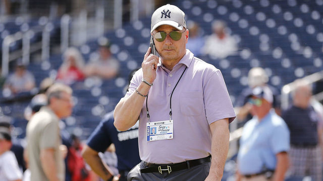 WEST PALM BEACH, FLORIDA - MARCH 12: New York Yankees general manager Brian Cashman talks on the phone prior to a Grapefruit League spring training game between the Washington Nationals and the New York Yankees at FITTEAM Ballpark of The Palm Beaches on March 12, 2020 in West Palm Beach, Florida. Many professional and college sports are canceling or postponing their games due to the ongoing threat of the Coronavirus (COVID-19) outbreak.