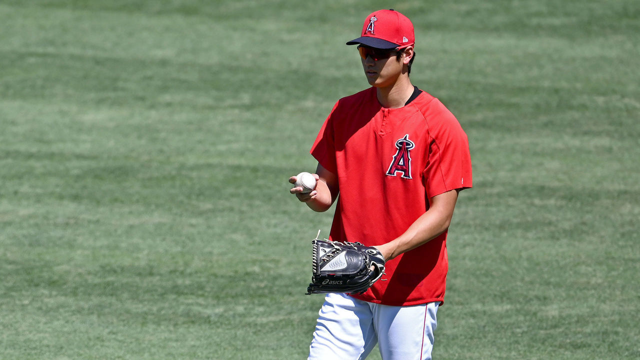 ANAHEIM, CA - JULY 11: Shohei Ohtani #17 talks with pitching coach Mickey Callaway #75 of the Los Angeles Angels as he warms up before throwing in the bullpen during summer training camp at Angel Stadium of Anaheim on July 11, 2020 in Anaheim, California.