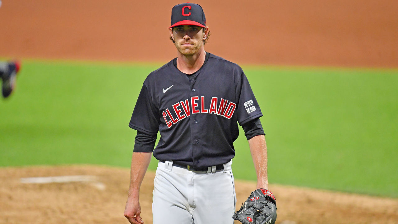 CLEVELAND, OHIO - JULY 24: Starting pitcher Shane Bieber #57 of the Cleveland Indians walks back to the dugout after the end of the top of the sixth inning of the Opening Day game against the Kansas City Royals at Progressive Field on July 24, 2020 in Cleveland, Ohio. The Indians defeated the Royals 2-0. The 2020 season had been postponed since March due to the COVID-19 pandemic.