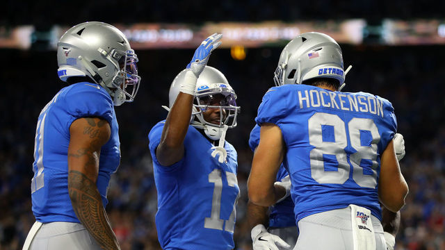 DETROIT, MICHIGAN - SEPTEMBER 29: T.J. Hockenson #88 of the Detroit Lions celebrates his touchdown with teammates Marvin Jones #11 and Marvin Hall #17 against the Kansas City Chiefs in the first quarter of the game at Ford Field on September 29, 2019 in Detroit, Michigan.