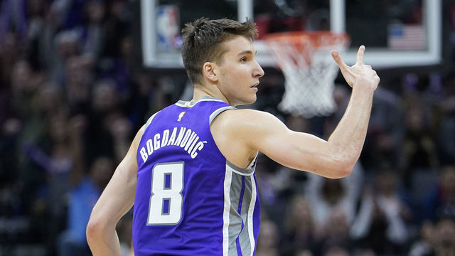 SACRAMENTO, CALIFORNIA - MARCH 08: Bogdan Bogdanovic #8 of the Sacramento Kings celebrates after making a three-point shot against the Toronto Raptors during the second half of an NBA basketball game at Golden 1 Center on March 08, 2020 in Sacramento, California.