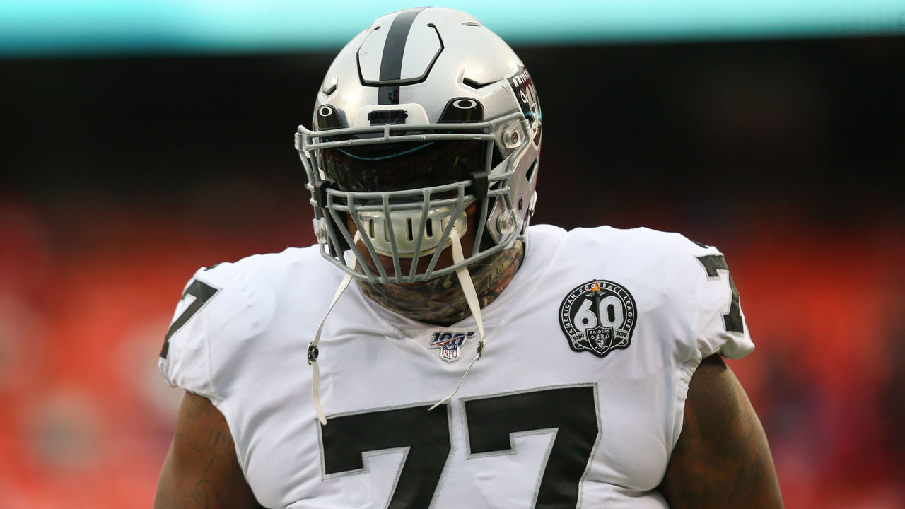 Las Vegas Raiders offensive tackle Trent Brown (77) warms up with a mask on  during a practice …