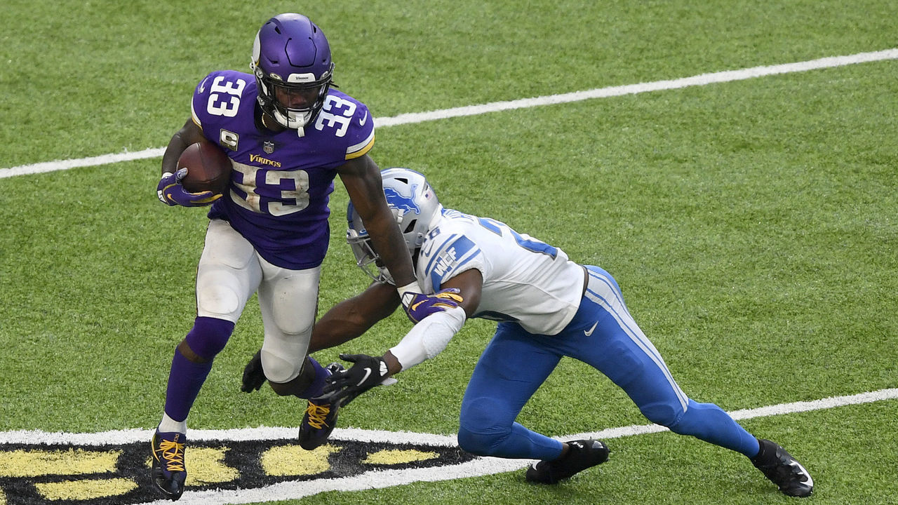 MINNEAPOLIS, MINNESOTA - NOVEMBER 08: Dalvin Cook #33 of the Minnesota Vikings is tackled by Duron Harmon #26 of the Detroit Lions at U.S. Bank Stadium on November 08, 2020 in Minneapolis, Minnesota.