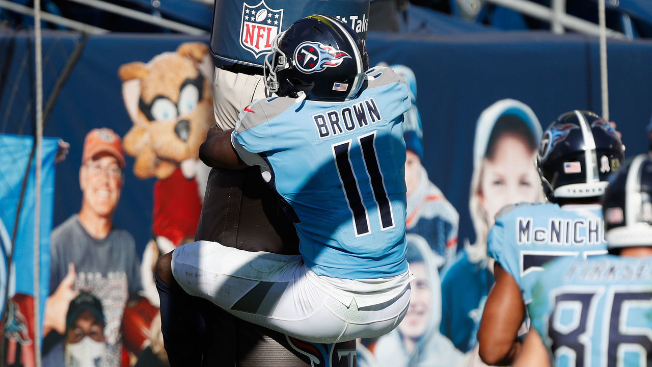 NASHVILLE, TENNESSEE - NOVEMBER 08: A.J. Brown #11 of the Tennessee Titans hugs the goal post after a first half touchdown against the Chicago Bears at Nissan Stadium on November 08, 2020 in Nashville, Tennessee.