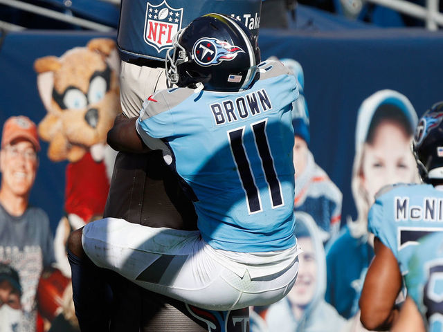 NASHVILLE, TENNESSEE - NOVEMBER 08: A.J. Brown #11 of the Tennessee Titans hugs the goal post after a first half touchdown against the Chicago Bears at Nissan Stadium on November 08, 2020 in Nashville, Tennessee.